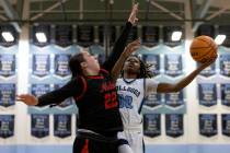 Centennial guard Kaniya Boyd (00) shoots against Coronado forward Ashtyn Wick (22) during a Cla ...