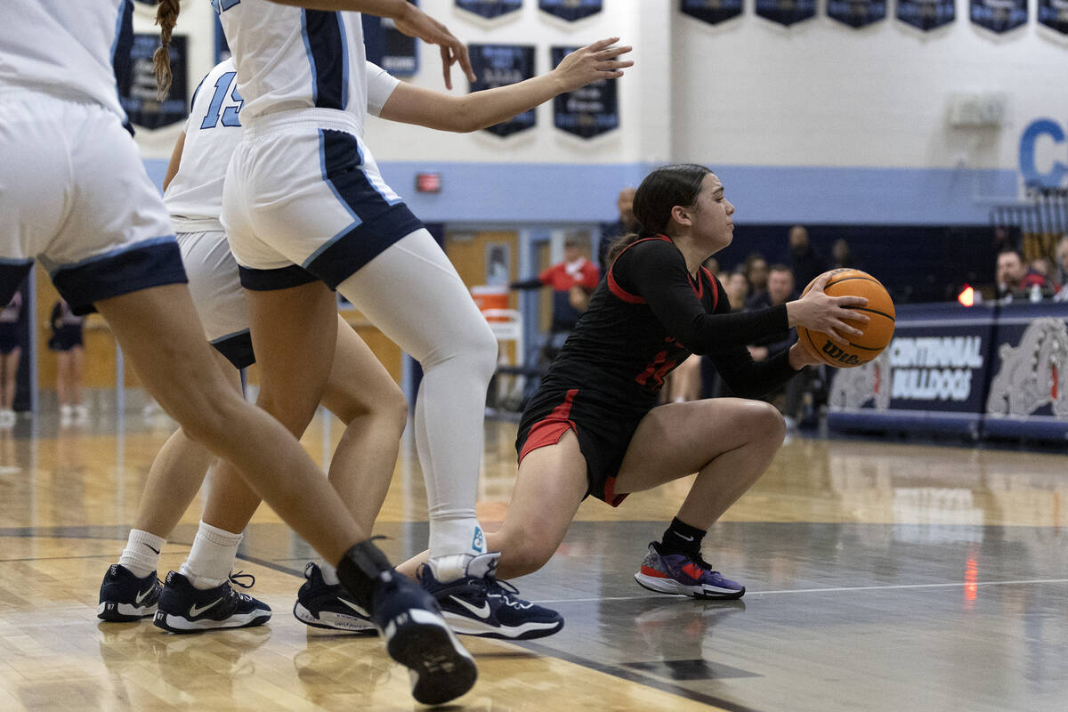 Coronado’s Kaylee Walters (14) falls to the ground while trying to overcome Centennial&# ...