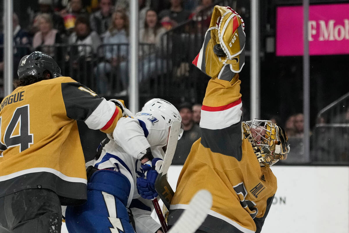 Vegas Golden Knights goaltender Adin Hill (33) catches the puck out of the air against Tampa Ba ...