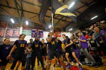 Durango High School players celebrate their 65-59 victory against Liberty High School after the ...