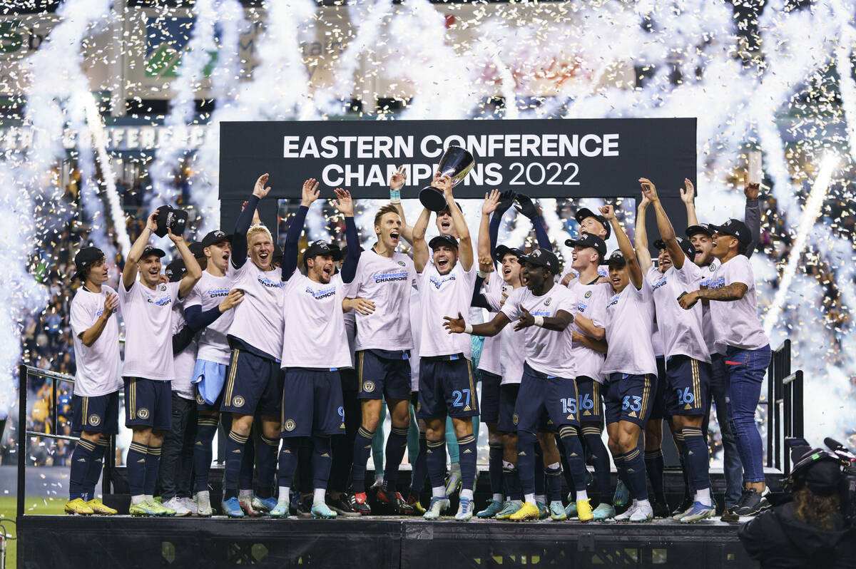 Philadelphia Union's Kai Wagner, center, lifts the trophy as the Philadelphia Union celebrates ...