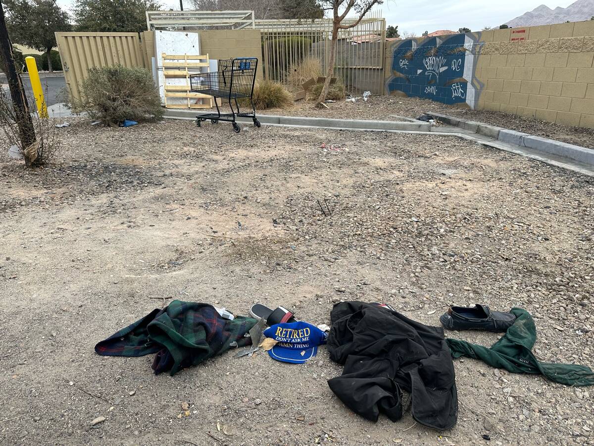 The scene behind an AutoZone at South Nellis Boulevard and East Desert Inn Road. A man and woma ...