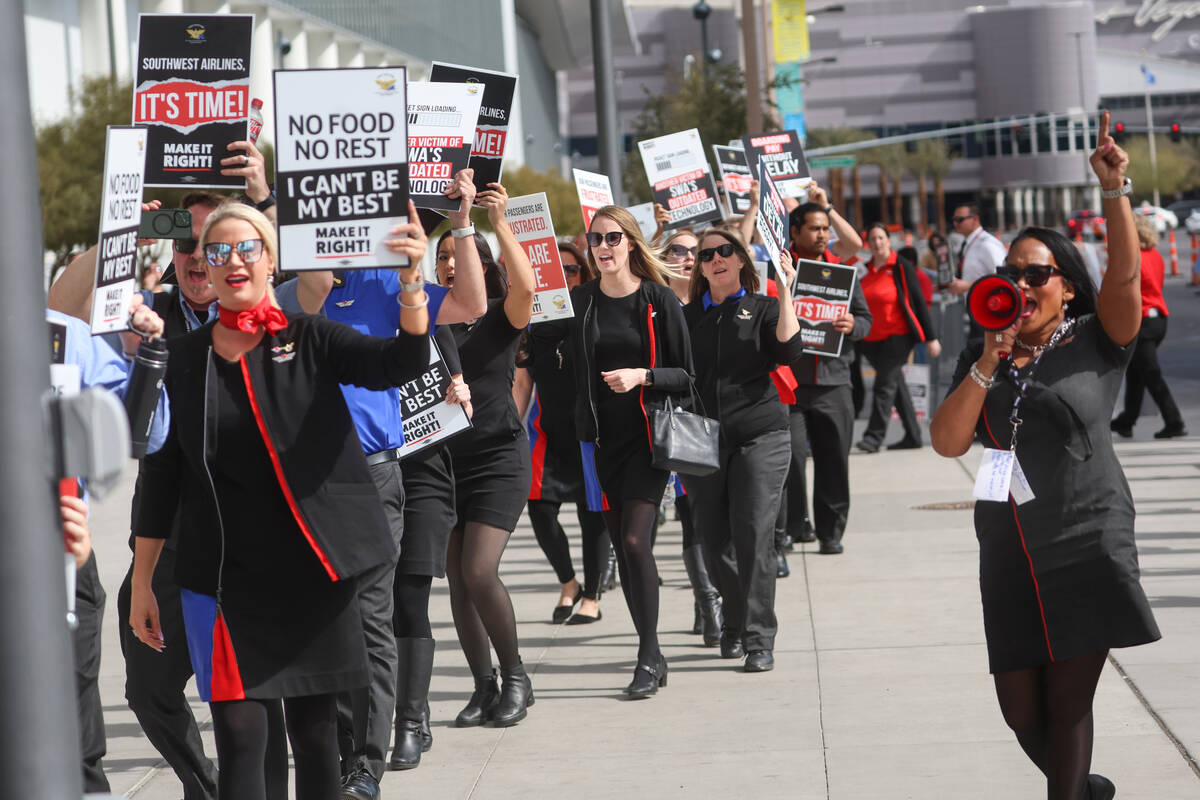 Members of Transport Workers Union Local 556, the union of Southwest Airlines flight attendants ...