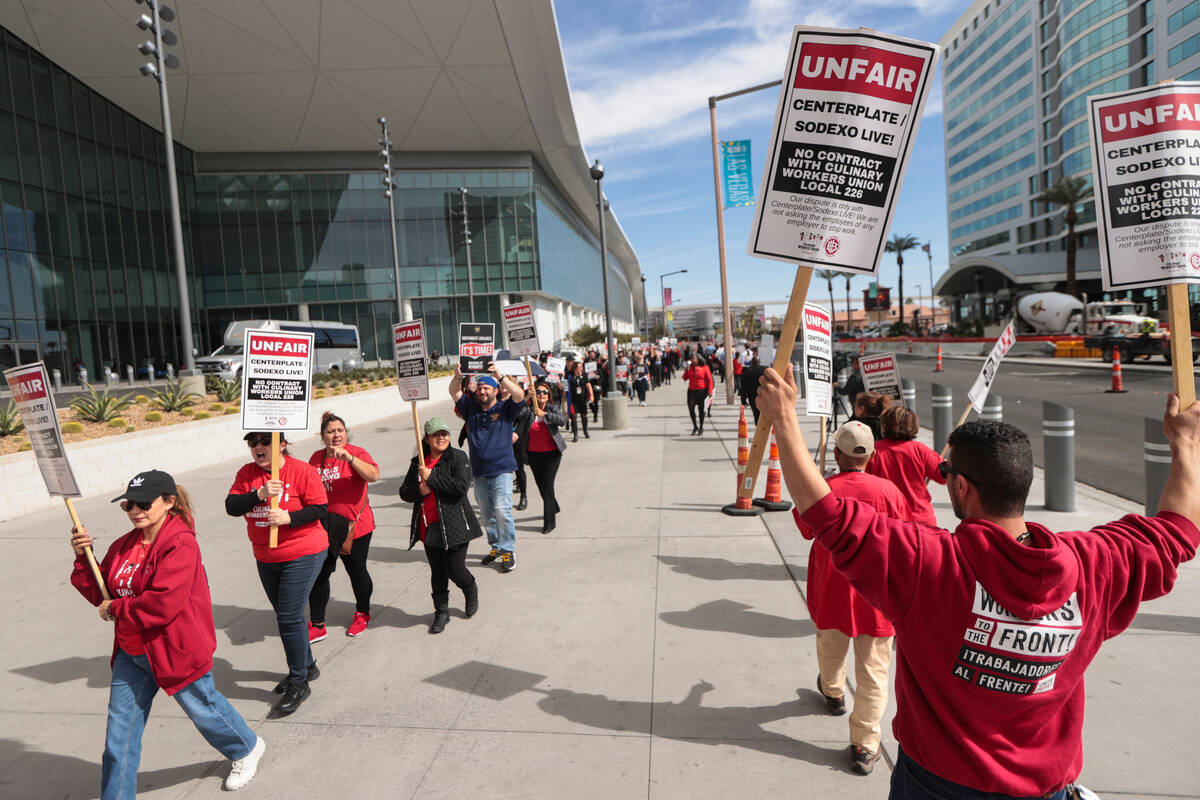 Culinary union members join a picket led by the Transport Workers Union Local 556, the union of ...