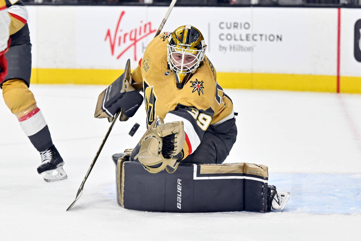 Vegas Golden Knights goaltender Laurent Brossoit defends against the Calgary Flames during the ...