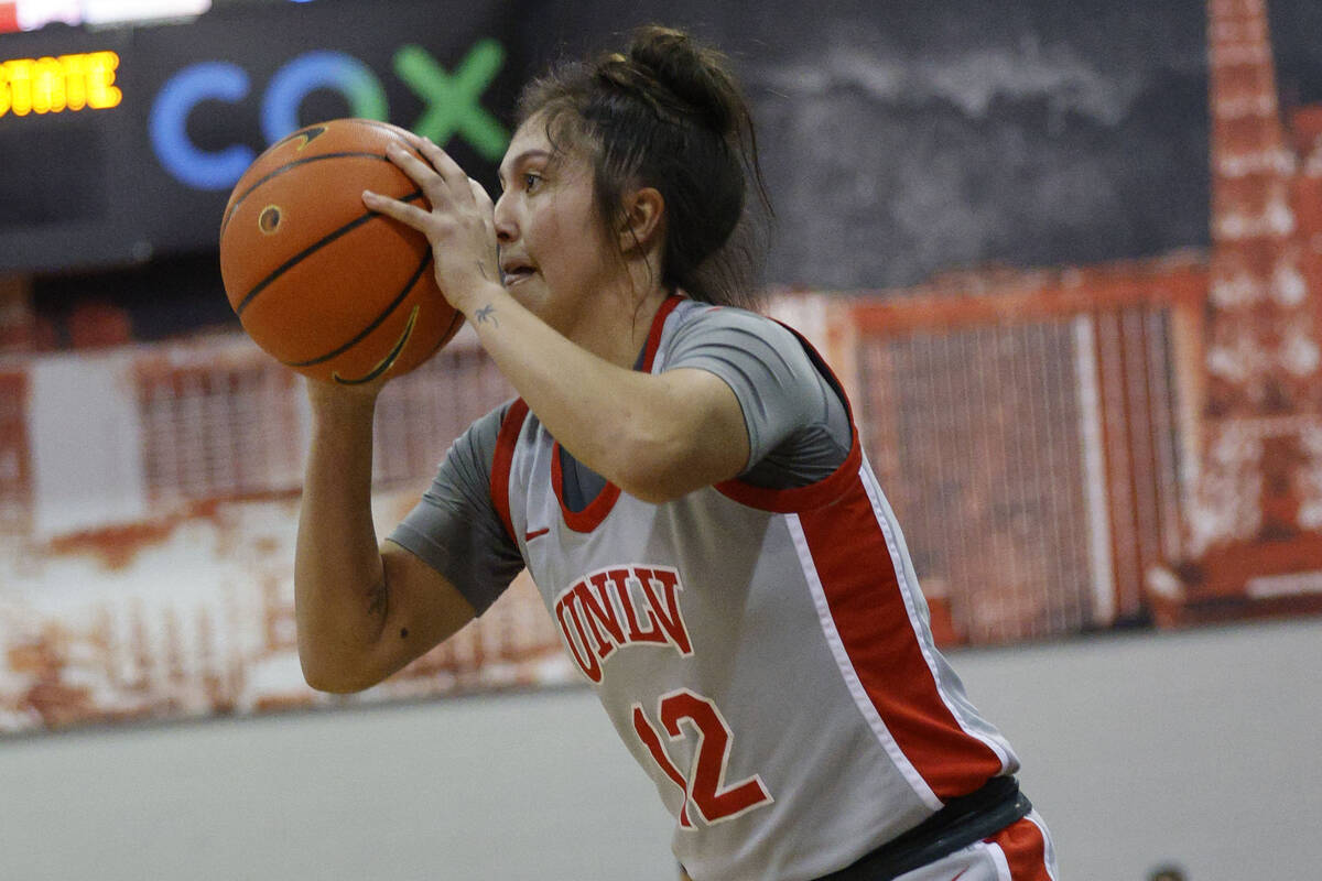 UNLV Lady Rebels guard Alyssa Durazo-Frescas (12) shoots a three-point shot during the first ha ...