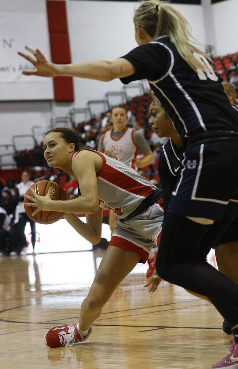 UNLV Lady Rebels guard Kiara Jackson (3), right, looks to pass against Utah State Aggies guard ...