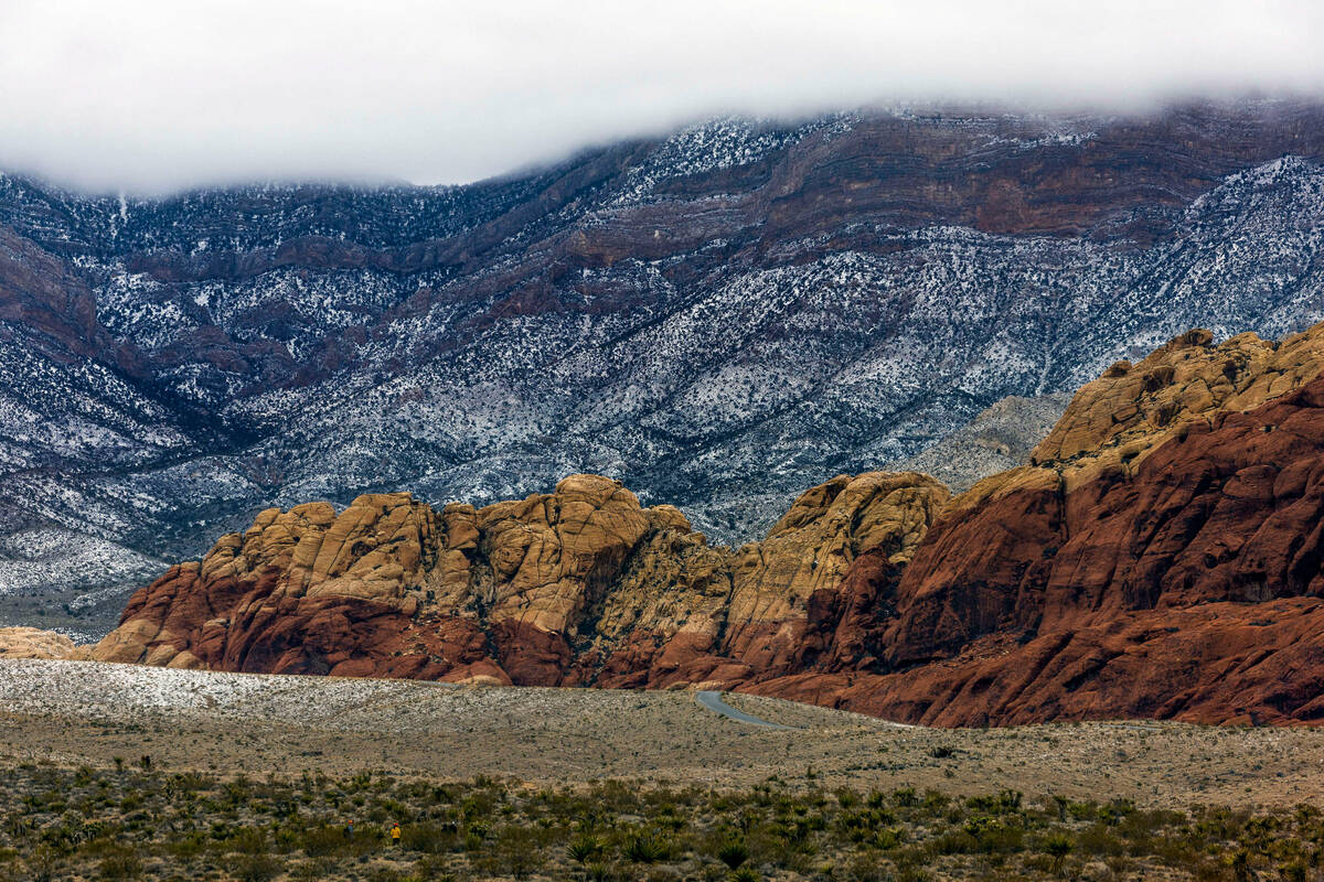 Visitors hike about the Red Rock Canyon National Conservation Area where scenic loop is tempora ...