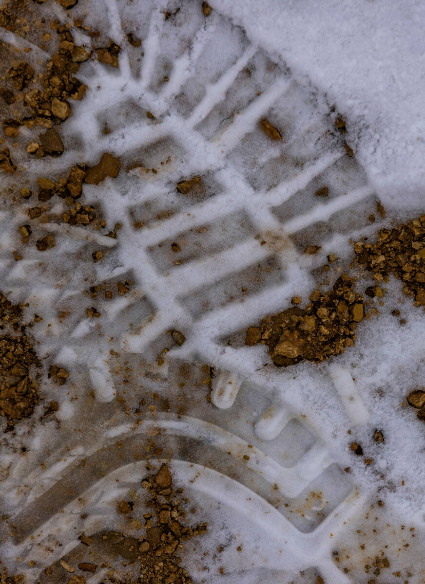 Snow prints from visitors hiking about the Red Rock Canyon National Conservation Area where sce ...