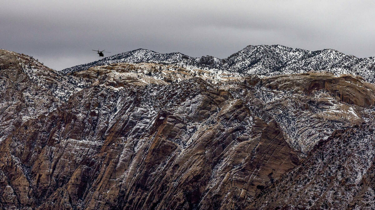 A helicopter flys over the Red Rock Canyon National Conservation Area where scenic loop is temp ...