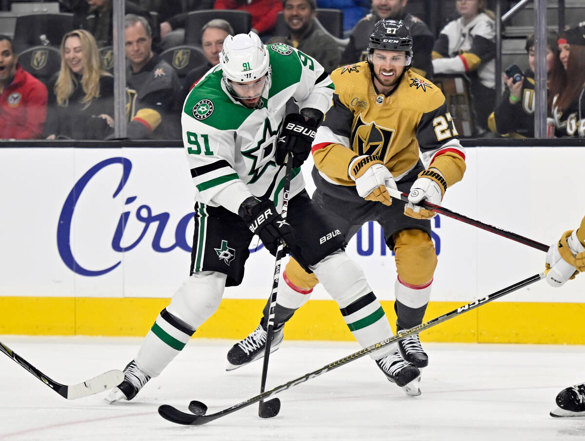 Dallas Stars center Tyler Seguin (91) skates with the puck against Vegas Golden Knights defense ...