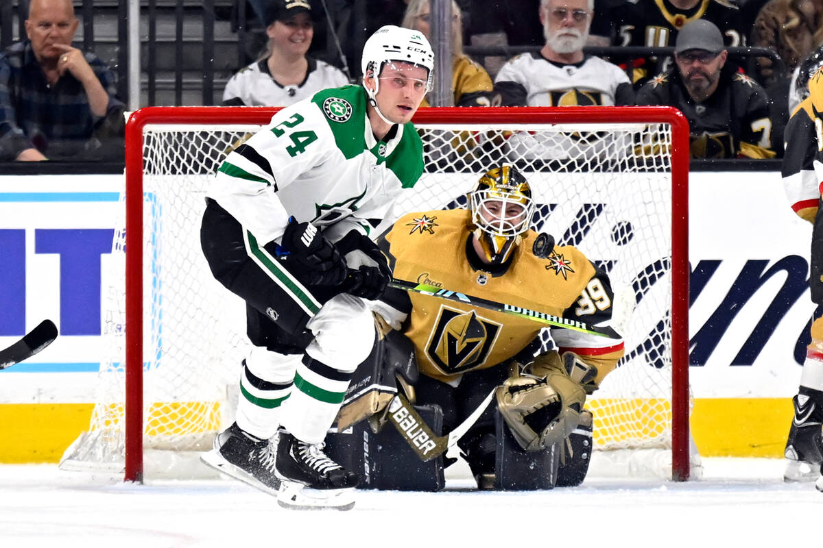 Dallas Stars center Roope Hintz (24) and Vegas Golden Knights goaltender Laurent Brossoit (39) ...