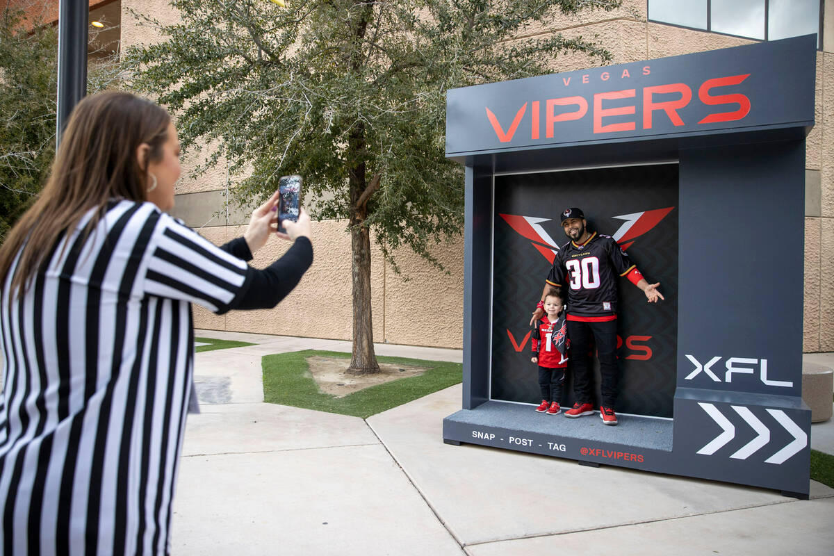 Las Vegans Koa Figueroa, left, and Freddy Figueroa pose before an XFL football game between the ...