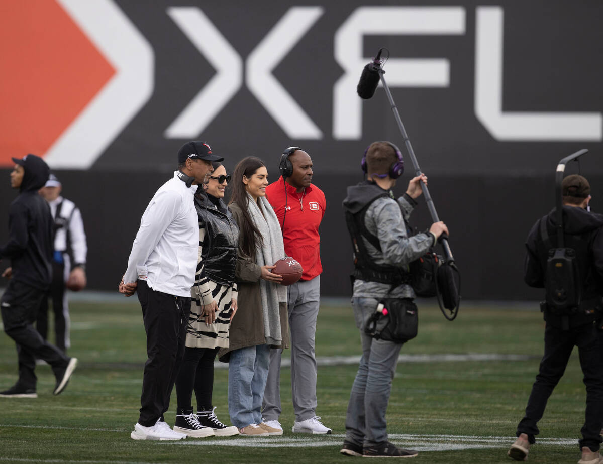 Vegas Vipers head coach Rod Woodson, left, and Las Vegas Aces Kelsey Plum, second from right, a ...