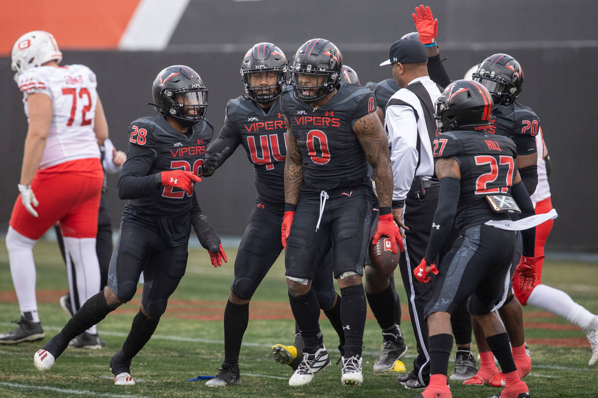 Vegas Vipers linebacker Pita Taumoepenu celebrates his fumble recovery against DC Defenders wit ...