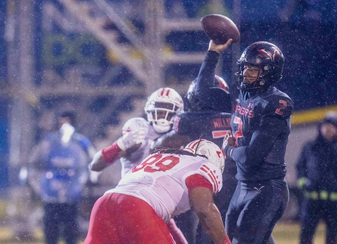 Vegas Vipers quarterback Brett Hundley (2) throws as DC Defenders defensive tackle Joe Wallace ...