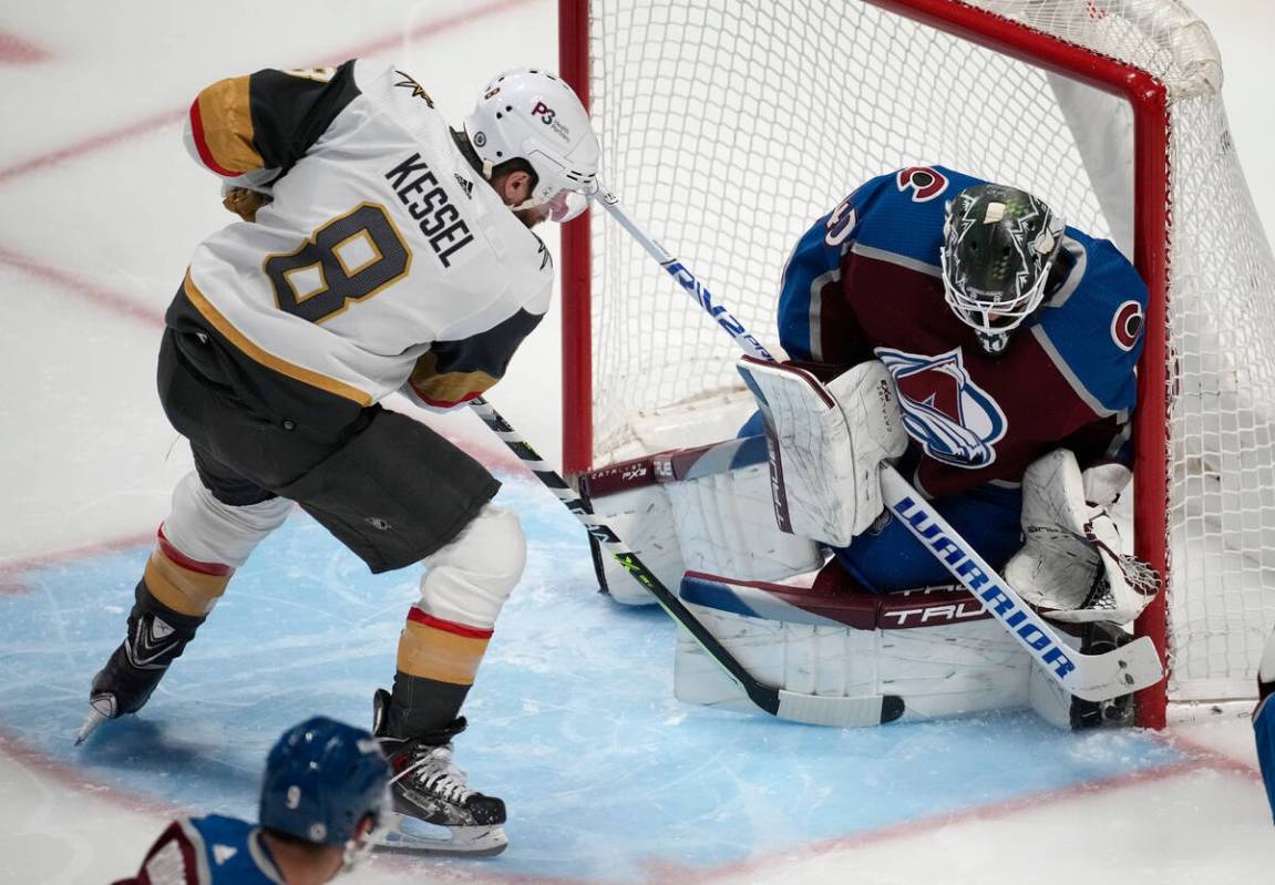 Colorado Avalanche goaltender Alexandar Georgiev, right, makes a stic-save against a shot by Ve ...