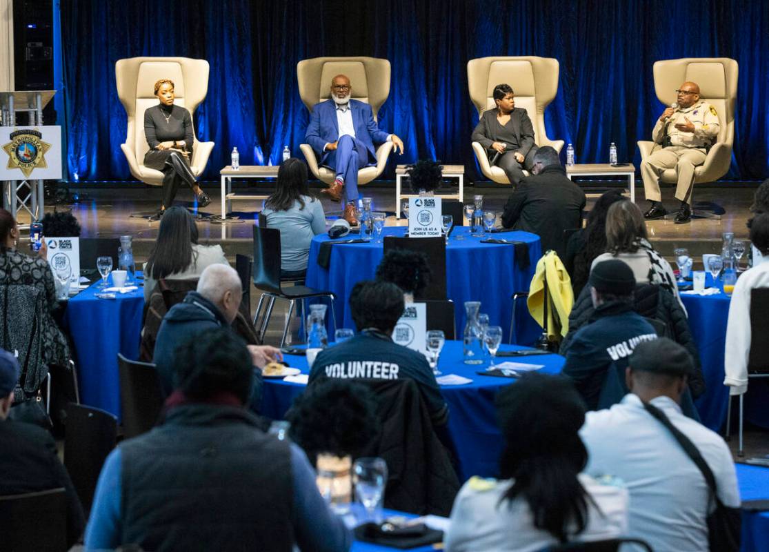 LVMPD Lt. Charles Jenkins, right, president, Black Police Officers Association, speaks as Tiara ...