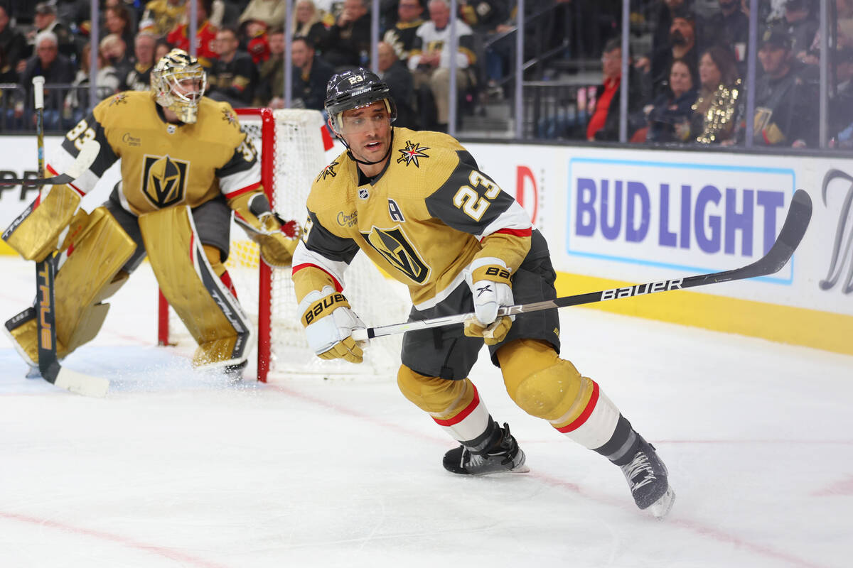 Vegas Golden Knights defenseman Alec Martinez (23) defends against the New Jersey Devils during ...