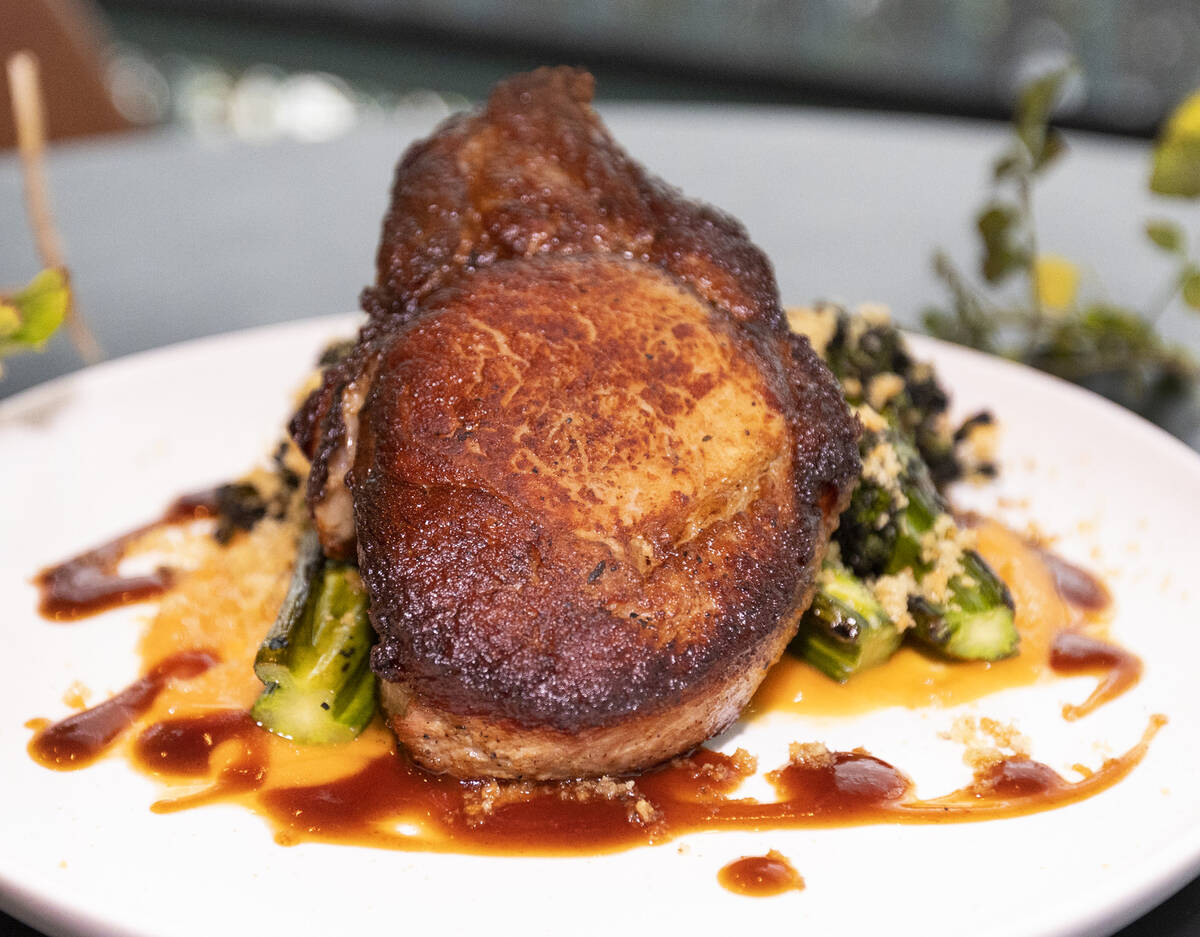 Anchor Steam Pork Chop served with sweet potato, broccolini, bread crumbs and honey-molasses sa ...