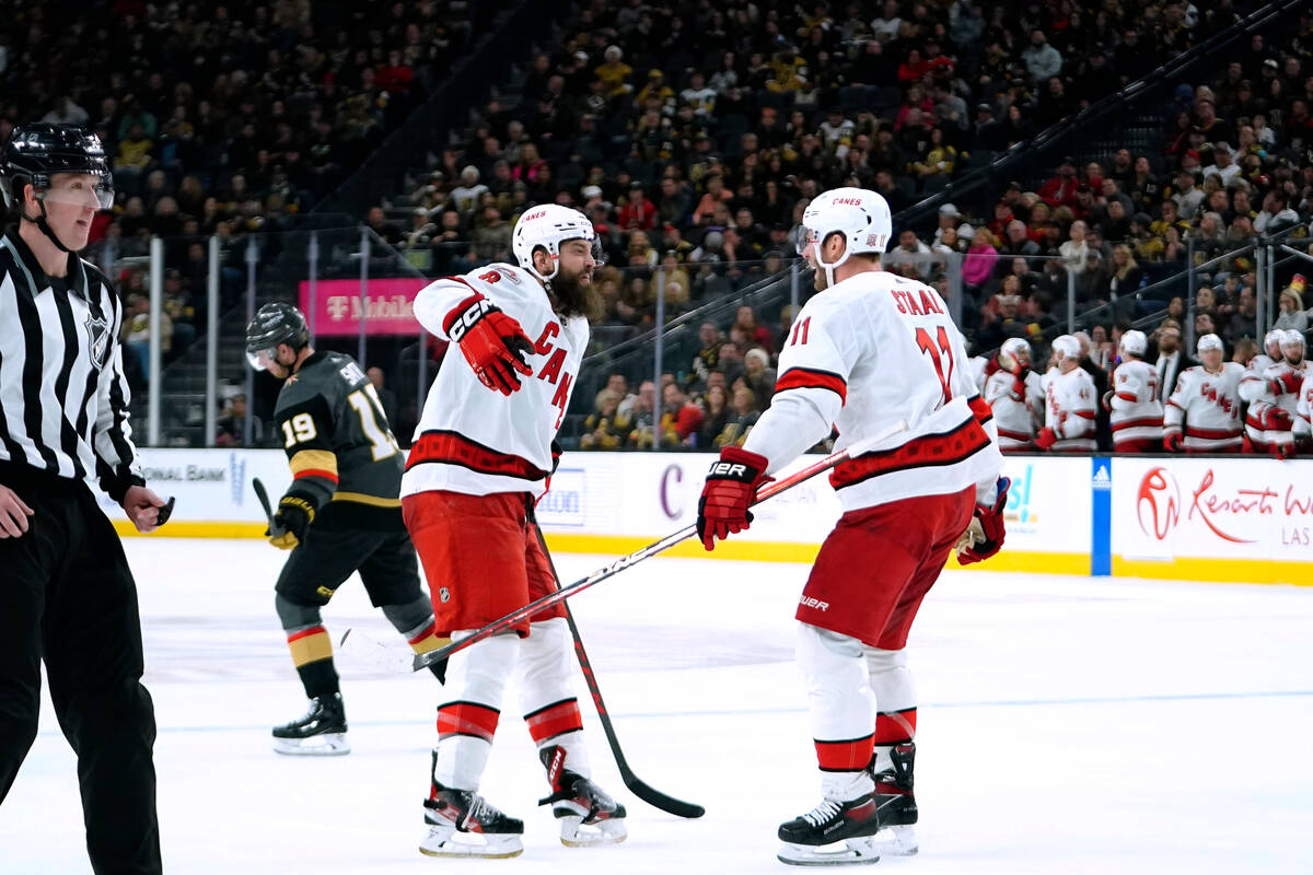 Carolina Hurricanes defenseman Brent Burns (8) celebrates with center Jordan Staal (11) after s ...