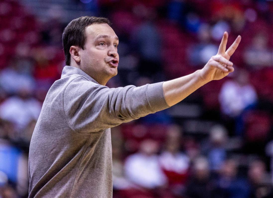 UNLV head coach Kevin Kruger signals his players against Utah State during the second half of t ...