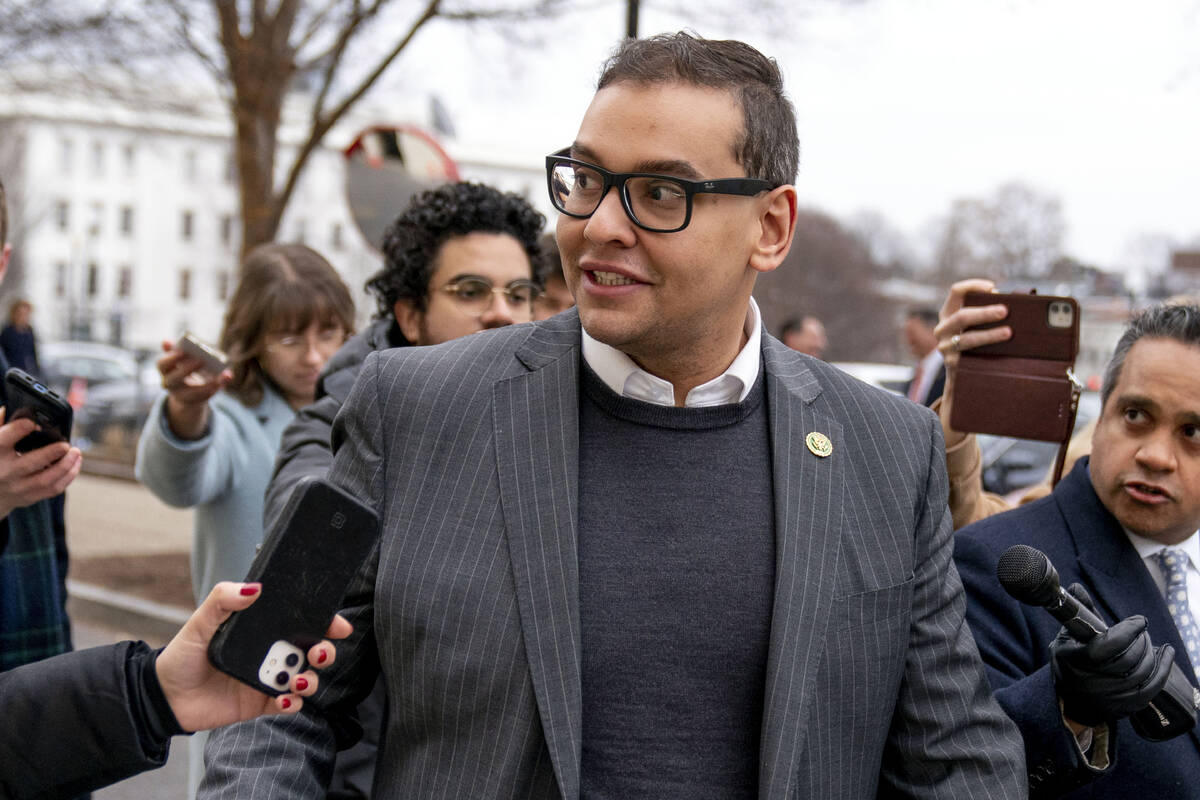 FILE - Rep. George Santos, R-N.Y., leaves a House GOP conference meeting on Capitol Hill, in Wa ...