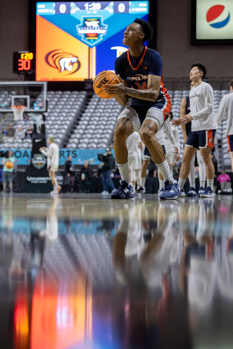 Pepperdine forward Maxwell Lewis (24), who is from Las Vegas, shoots during warmups before a We ...