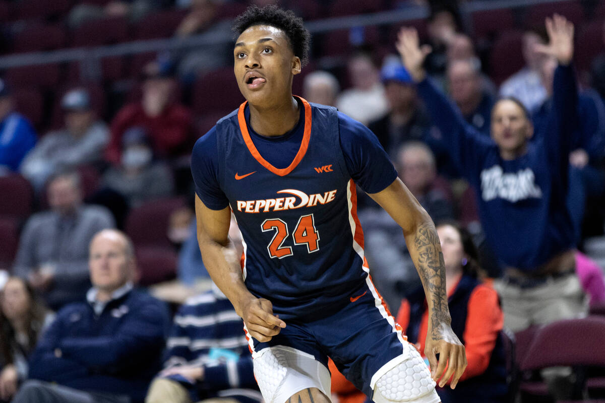 Pepperdine forward Maxwell Lewis (24), who is from Las Vegas, watches to see if his shot makes ...