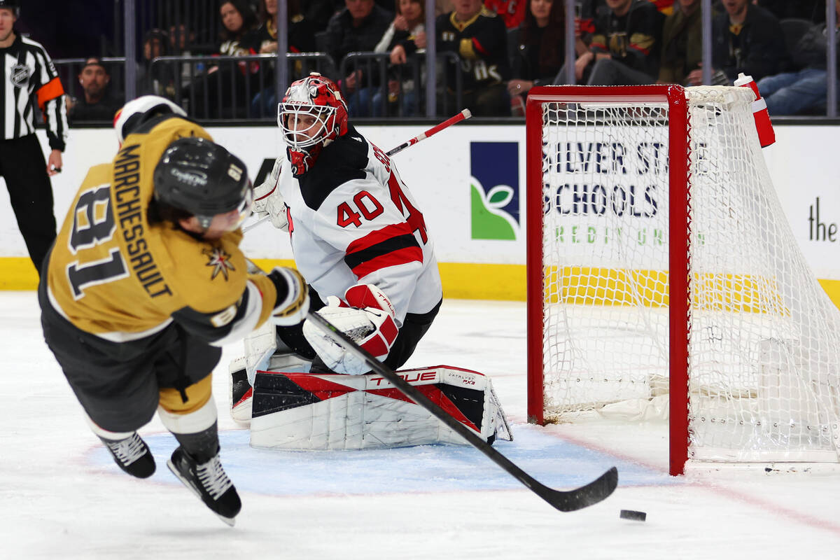 Vegas Golden Knights right wing Jonathan Marchessault (81) shoots the puck for a score as New J ...