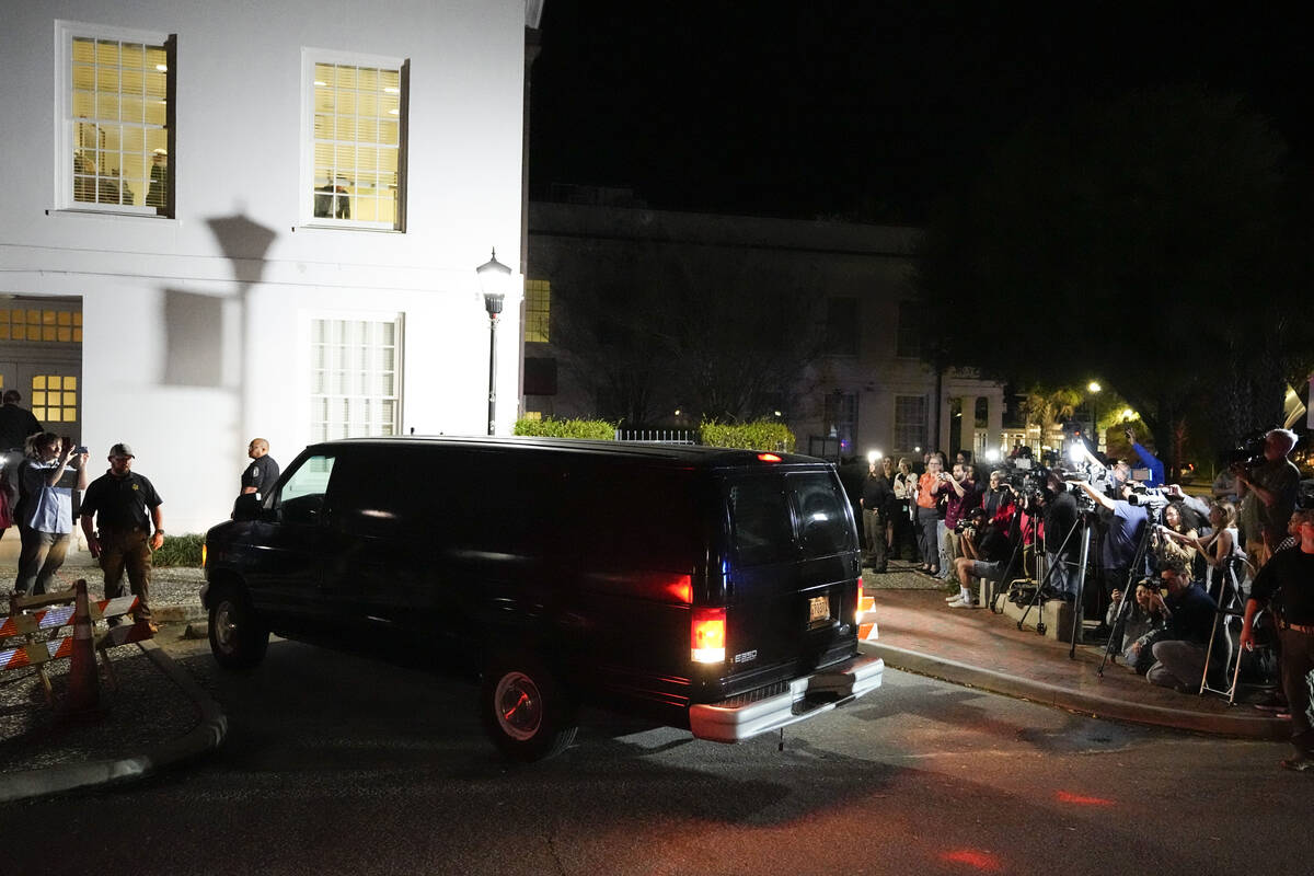 Members of the media and onlookers watch as a van leaves with Alex Murdaugh outside the Colleto ...