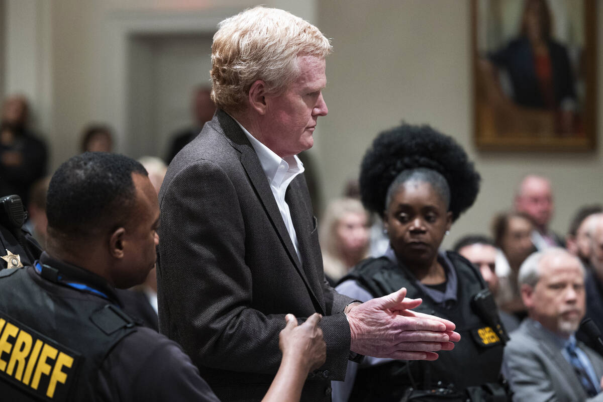 Alex Murdaugh, center, is handcuffed in the courtroom after a guilty verdict in his murder tria ...