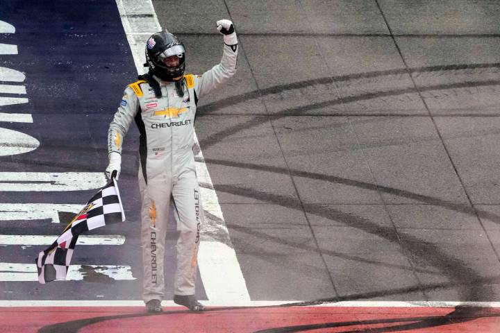 Kyle Busch celebrates after winning a NASCAR Cup Series auto race at Auto Club Speedway in Font ...