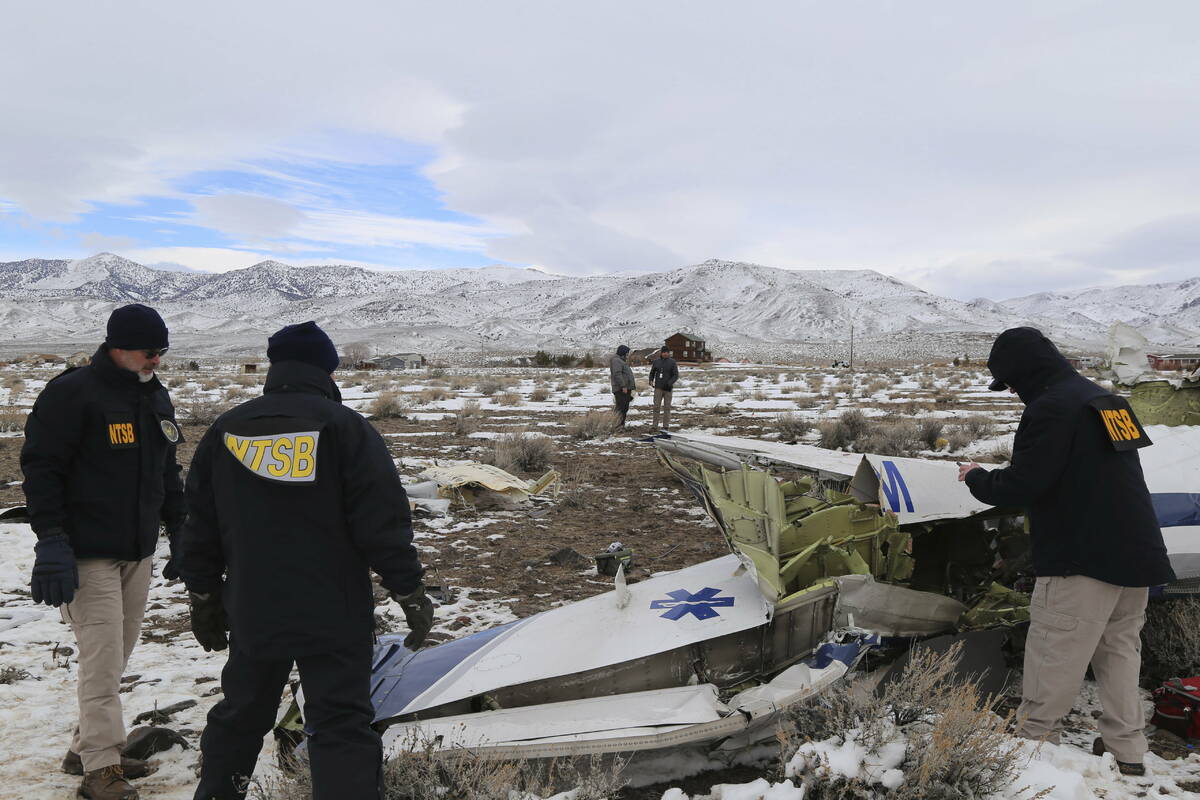 This photo provided by The National Transportation Safety Board shows NTSB investigators on Sun ...