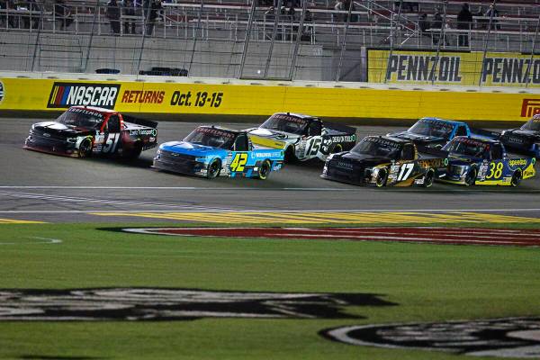 Kyle Busch (51) leads the pack during the NASCAR Craftsman Truck Series auto race at Las Vegas ...