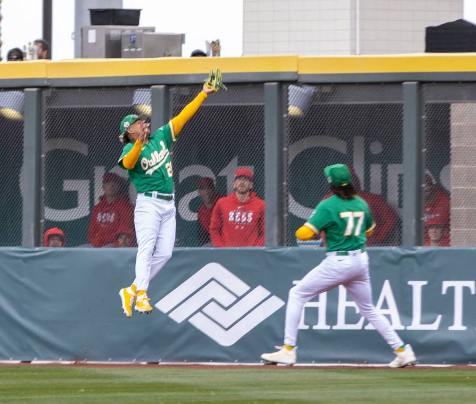 Oakland Athletics center fielder Cristian Pache (20) makes a catch on the warning track as Oakl ...