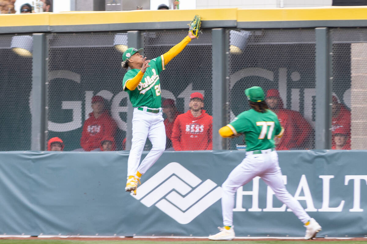 Oakland Athletics center fielder Cristian Pache (20) makes a catch on the warning track as Oakl ...