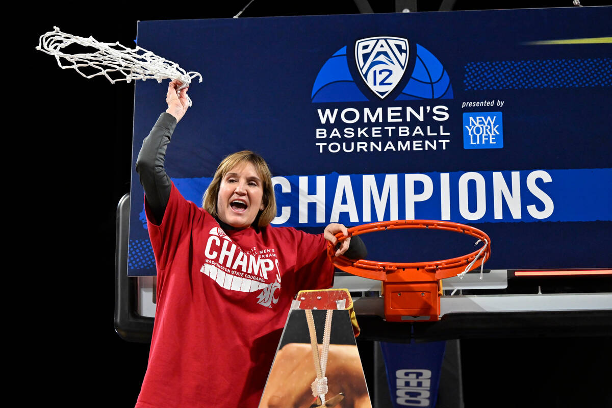 Washington State head coach Kamie Ethridge celebrates after the team defeated UCLA in an NCAA c ...