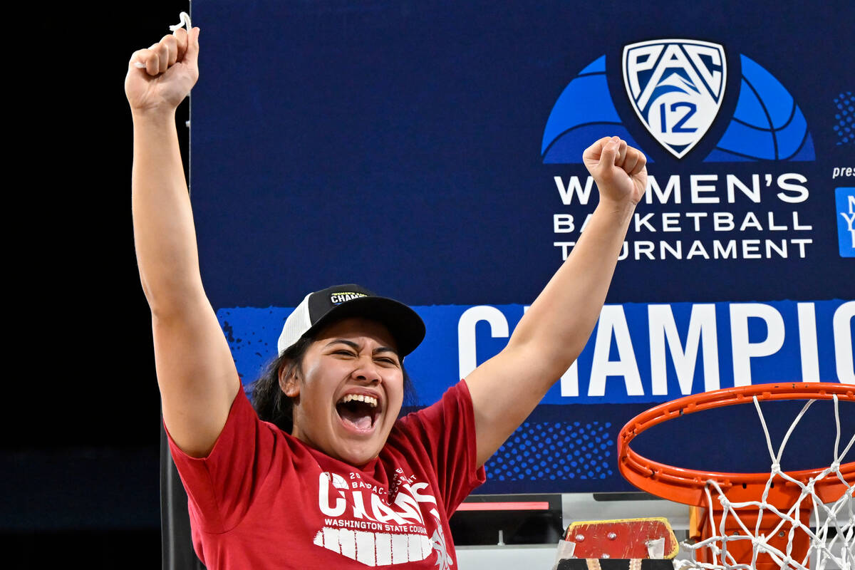 Washington State forward Ula Motuga celebrates after the team defeated UCLA in an NCAA college ...