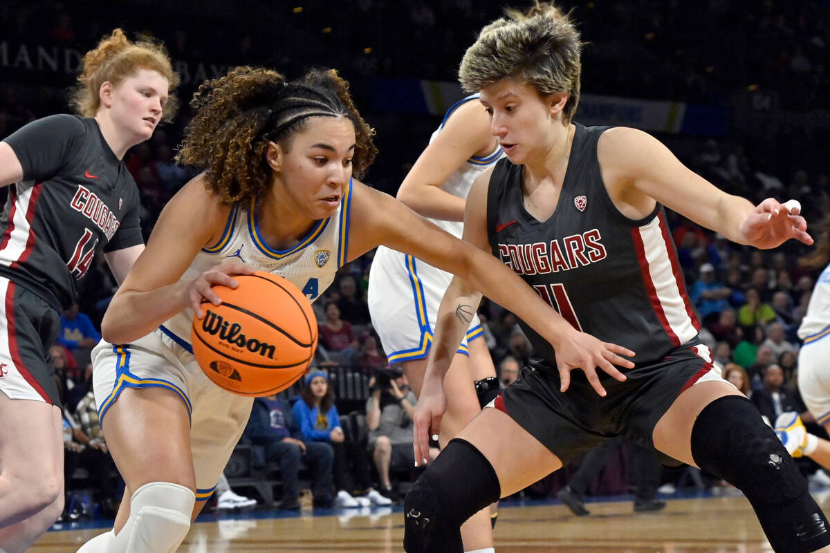 UCLA guard Kiki Rice, left, drives the ball against Washington State guard Astera Tuhina during ...