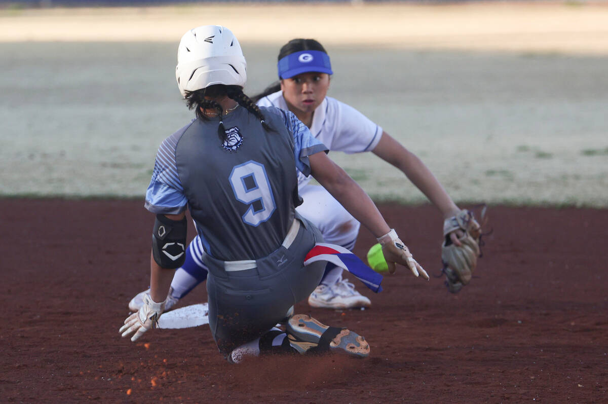 Centennial's Amanda Campos-Colon (9) slides onto second base against Bishop Gorman's Allie Bern ...