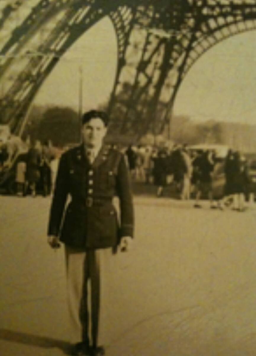Herbert Muskin poses in front of the Eiffel Tower in an undated photo, following his service in ...