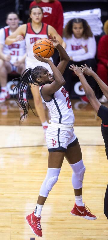 UNLV center Desi-Rae Young (23) elevates for a basket over San Diego State forward Yummy Morris ...