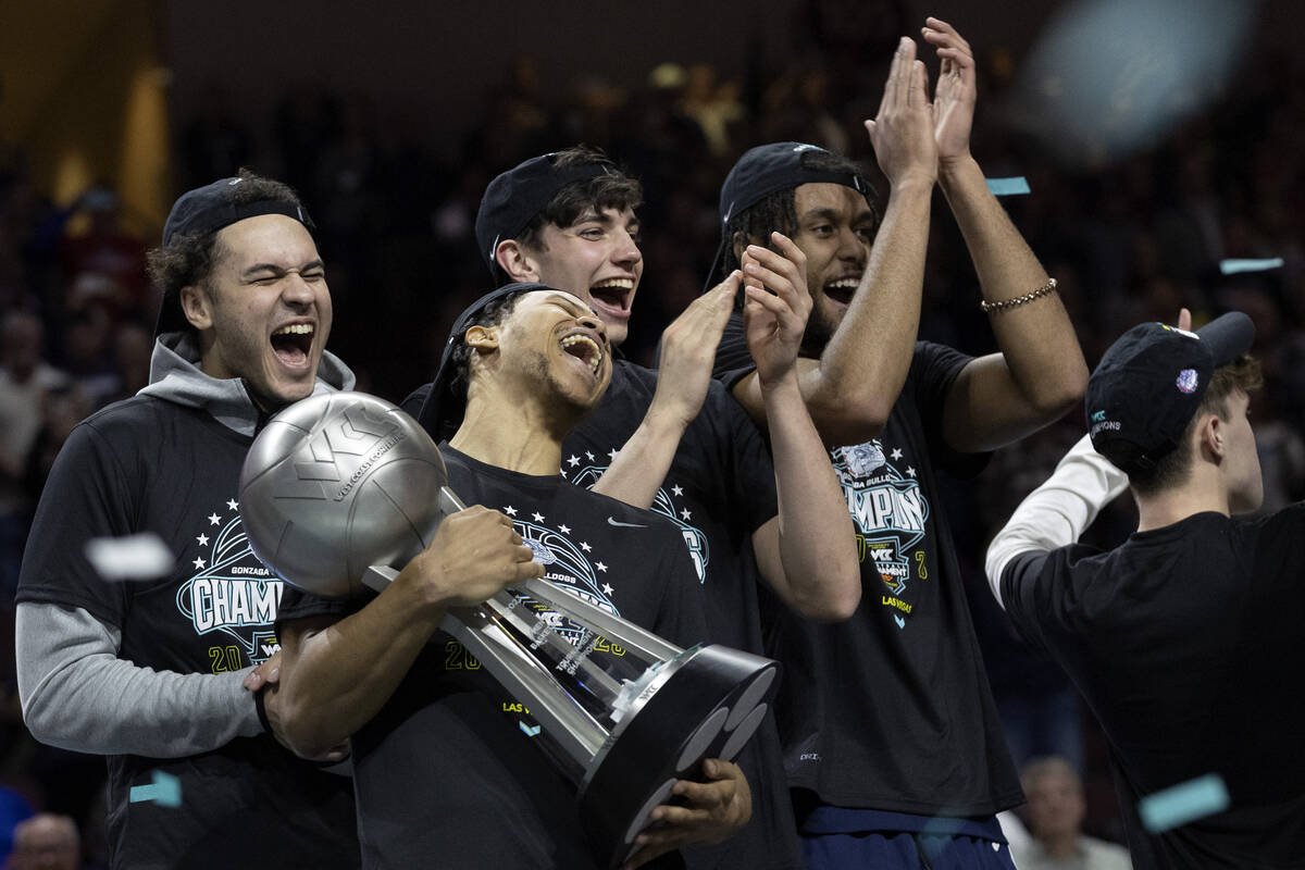 The Gonzaga Bulldogs celebrate after winning a West Coast Conference men’s basketball ch ...