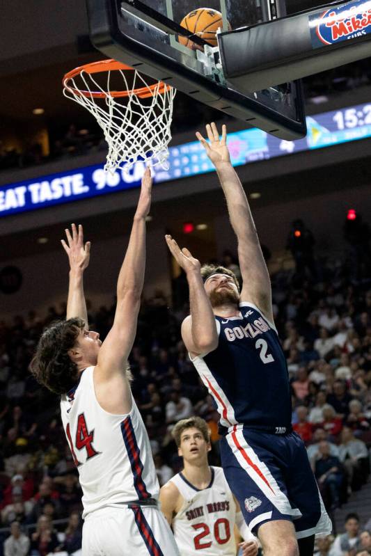 Gonzaga Bulldogs forward Drew Timme (2) shoots against St. Mary's Gaels forward Kyle Bowen (14) ...