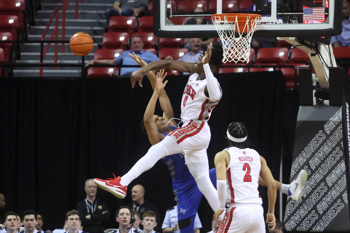 UNLV forward Victor Iwuakor (0) blocks the shot of Air Force forward Nikc Jackson (22) during t ...