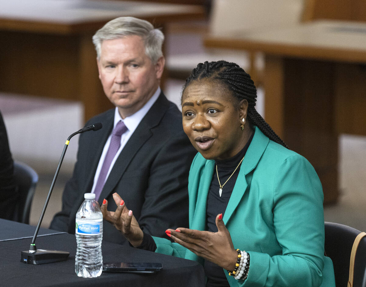 Belinda Harris, a North Las Vegas judge, speaks as Darin Imlay, a public defense attorney, look ...