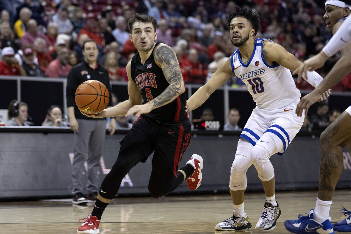 UNLV Rebels guard Jordan McCabe (5) drives toward the hoop followed by Boise State Broncos guar ...