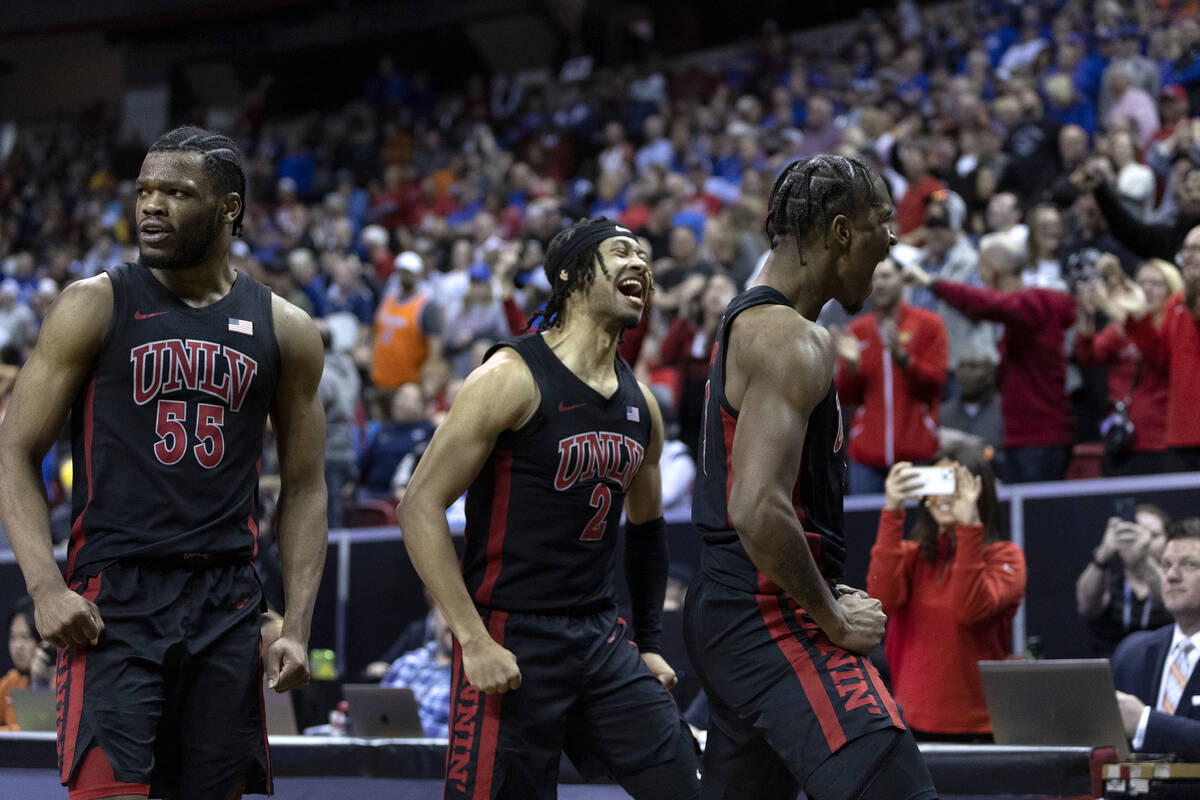 UNLV Rebels guard EJ Harkless (55), UNLV Rebels guard Justin Webster (2) and UNLV Rebels guard ...