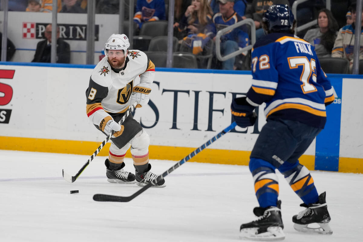 Vegas Golden Knights' Phil Kessel (8) controls the puck as St. Louis Blues' Justin Faulk (72) d ...